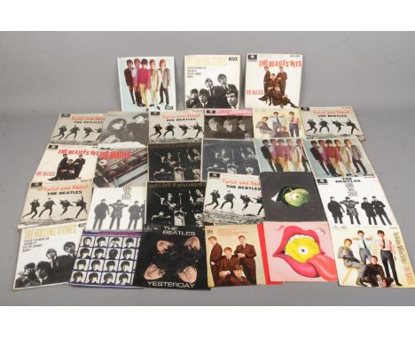 A quantity of The Beatles and The Rolling Stones single records.  