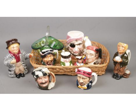 A tray of ceramic character jugs and a green glass basket. Includes Royal Doulton Trapper D6612 example etc.  
