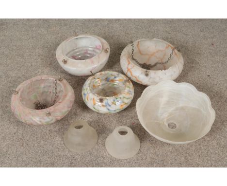 A quantity of vintage light shades, mainly hanging.  Chips to orange and pink marbled examples.