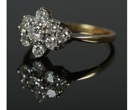 An 18ct gold nine stone diamond cluster ring, approx. .5 carats total. Size K, 2.5g.  