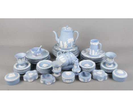 A large collection of Wedgwood blue Jasperware. Includes teapot, Christmas year plates, trinket dishes, cups and saucers etc.