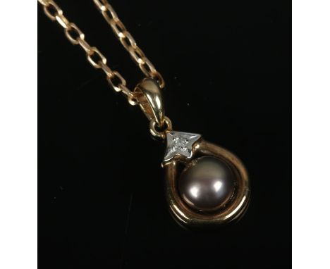 A 9ct gold pendant on chain set with single pearl and diamond. Total weight 3.4g.  