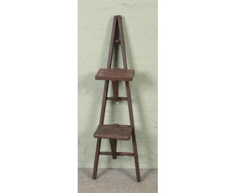 A painted five rung wooden A-Frame ladder, possibly for fruit picking, with two platform steps. Height: 151cm.  