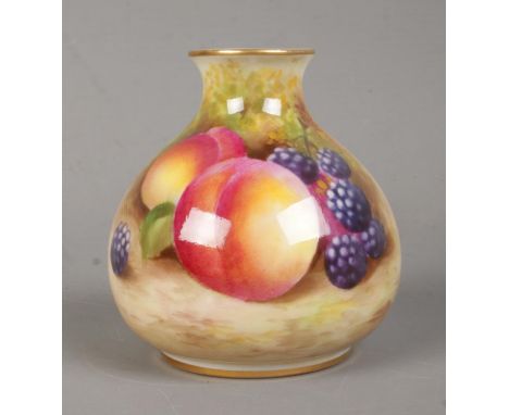 A Royal Worcester narrow neck squat vase, depicting a still life scene of fruit. Stamped to base 2491, date marks for 1936. 7