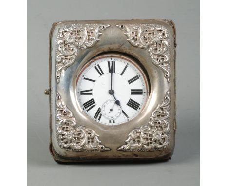 A white metal cased goliath open face pocket watch in a silver mounted watch case with easel back. The case assayed for Londo