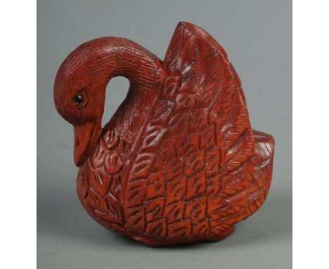 A hand carved hardwood netsuke of a swan, signed to base.  