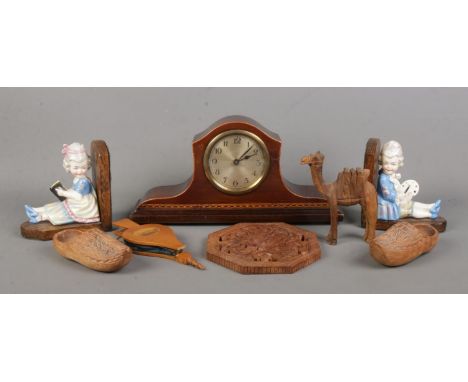 A quantity of woodenwares, including manual wind mahogany mantle clock with banded inlay, wooden clogs, bookends mounted with