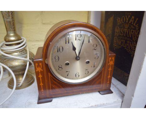 An Edwardian walnut and inlaid mantel clock, 23.5cm wide. 