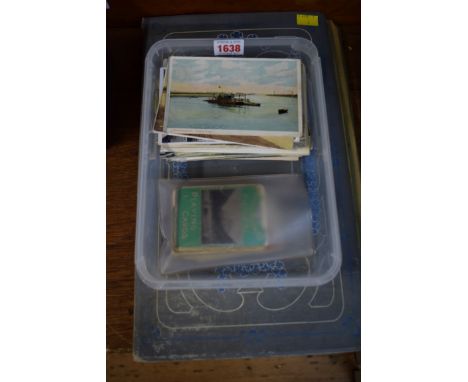 An album of postcards; together with a further quantity of loose cards; and a pack of Muir & Moodie's pictorial playing cards