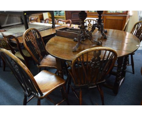 An early 18th century oak gateleg table, with frieze drawer and bobbin turned legs, 142.5cm wide when open. 