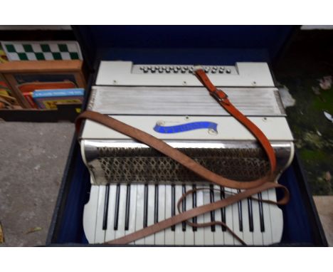 A Tonella piano-accordion, boxed. 