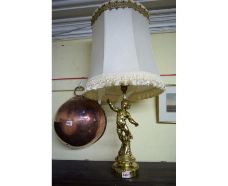 A brass cherub table lamp, height excluding fitting 34cm. 