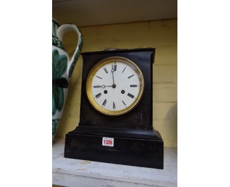 A Victorian slate mantel clock, striking on a bell, 32cm high.