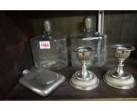 A pair of pewter mounted etched glass bottles; together with a pair of electroplated dwarf candlesticks; and a hip flask. 