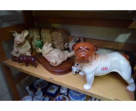 A collection of pig models; together with a Melba ware bulldog. 