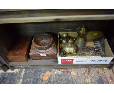 A mixed lot, to include: an antique brass pepper grinder; further eastern brass; a tribal carved wood mortar, etc. 