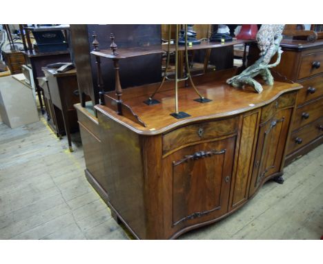 A 19th century Continental mahogany serpentine fronted sideboard, with open shelf back, 148cm wide.