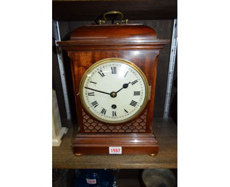An early 20th century mahogany mantel clock, height including handle 34.5cm.