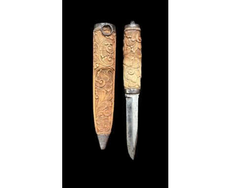 Scandinavian hunting knife (possibly Norwegian), sheathed hunting knife with carved light wood foliate scrawling decoration. 