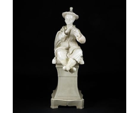 A white ceramic figure of a sitting Oriental man with a hat 100x33x41cm. (haircracks)
