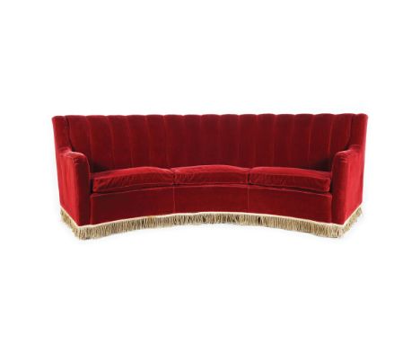 A red velvet coated arched line sofa 89x280x100cm. circa