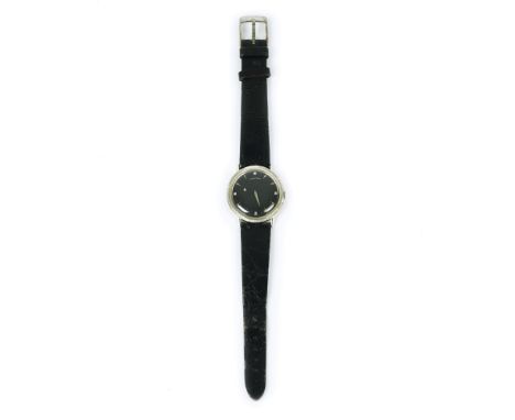 A 14kt. gold cased Longines wristwatch, '50s/'60s 35mm. diam; black dial; manual winding movement; black leather strap (worki