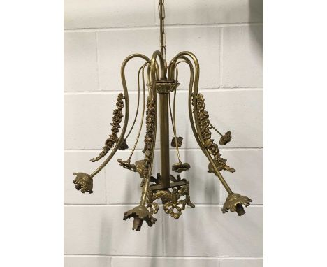 A Brass Ormolu Chandelier with flower garlands, together with a Black wrought iron chandelier. The first 42cm x 50cm with cha