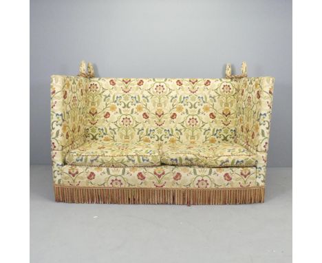 An upholstered two-seater Knole sofa. Overall 175x118x90cm, seat 158x44x74cm.Generally good condition, except the sides have 