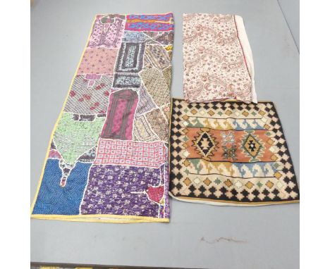 A Kashmiri chain stitch wall hanging, 75x72cm, patchwork wall hanging, 194x44cm, and an embroidered shawl, 223x105cm. (3) 
