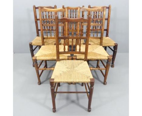 A harlequin set of six north country style dining chairs, with bobbin turned backs and rush seats.The set comprises three pai