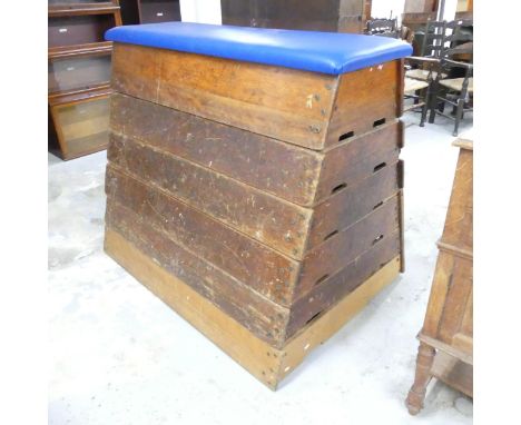 A vintage oak school gymnasium vaulting horse. 140x117x99cm.Some marks and scratches. This has been converted to a seat with 