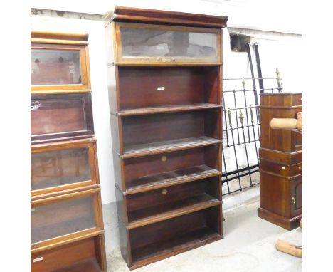 A Globe Wernicke mahogany sectional stacking bookcase, with four shelves and maker's labels. Overall 87x184x31cm.Only one doo