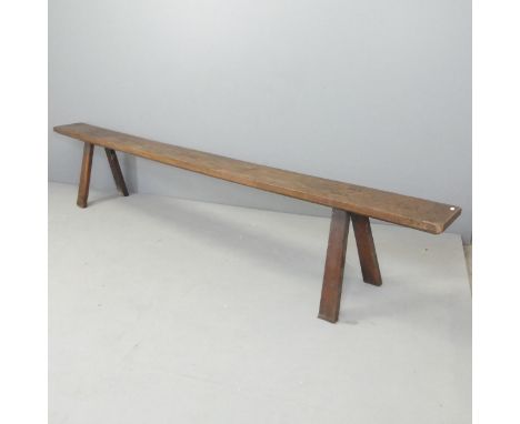 A 19th century oak bench with A frame legs. 274x50x35cm.Good overall condition with signs of age and use. Natural split to on