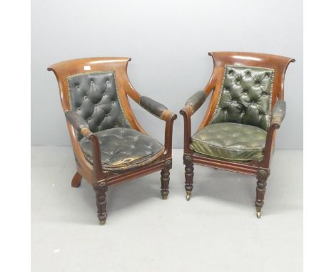 A pair of 19th century mahogany and button-back leather upholstered library armchairs. 