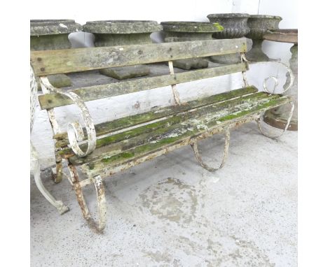 A teak slatted garden bench with cast iron ends. 180x82x55cm. 