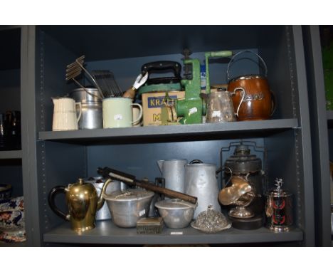 An assortment of vintage kitchenalia, including enamel mugs, iron, mincer and similar.