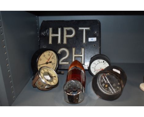 A 1960s Lucas rear light cluster, British Leyland (possibly Humber super snipe) also included are a selection of gauges and a