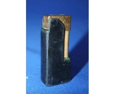 GILT DUNHILL LIGHTER
in leather case