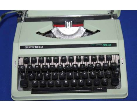 VINTAGE SILVER REED SR22 PORTABLE TYPEWRITER
body and case cover in sage green plastic, 31cm long