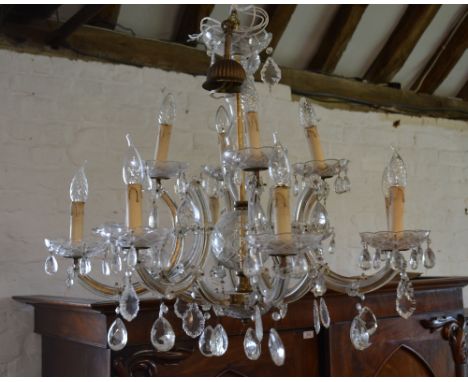 A Cut Glass Twelve Branch Chandelier with Facet Cut Glass Drops, 78 cms diameter