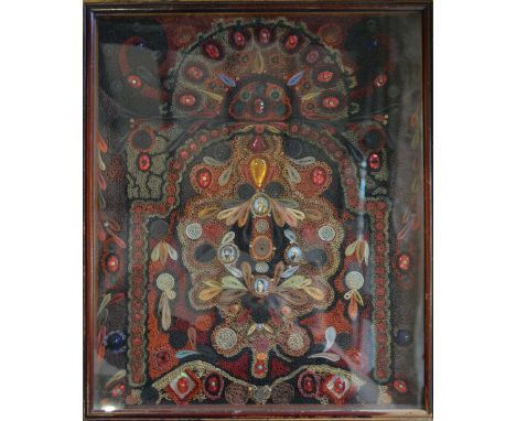 A Regency Rolled Paper Plaque, inset with paste stones and four small portrait miniatures, 40 x 33 cms