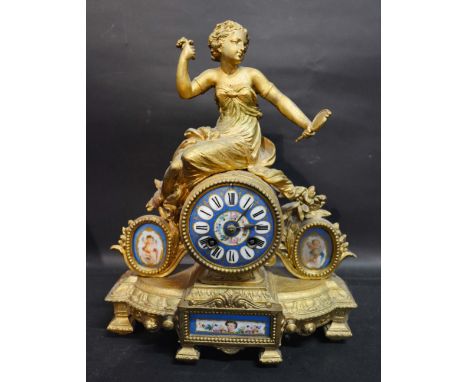 A 19th Century Gilded Spelter and Porcelain Mounted Mantle Clock, the porcelain dial with Roman numerals and two train moveme