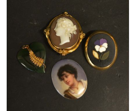 A Late 19th Early 20th Century Oval Cameo Brooch within a yellow metal frame together with a Pietra Dura oval brooch, a small
