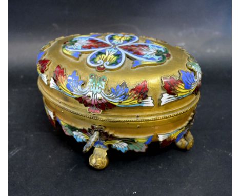 A 19th Century French Gilded and Enamel Decorated Oval Jewellery Casket, the hinged cover enclosing a pleated interior upon b