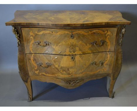 A French Kingwood Marquetry Inlaid and Gilt Metal Mounted Serpentine Commode, with two drawers and brass handles and escutche
