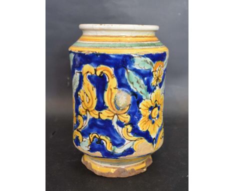 An Early Albarello Decorated with Foliage upon a blue and yellow ground, 18 cms tall