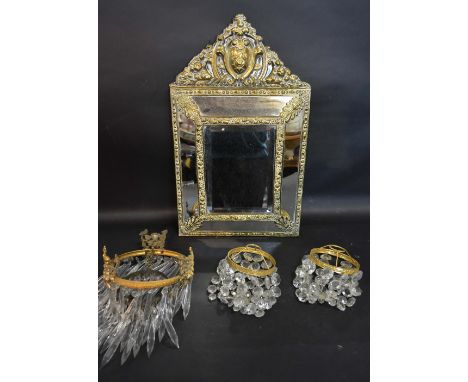 A Late 19th Century Brass Cushion Mirror together with a gilded light fitting with facet cut glass drops and a pair of simila