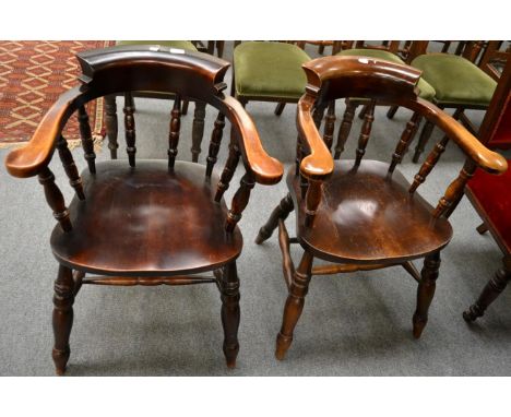 A pair of 20th century smokers bow armchairs 