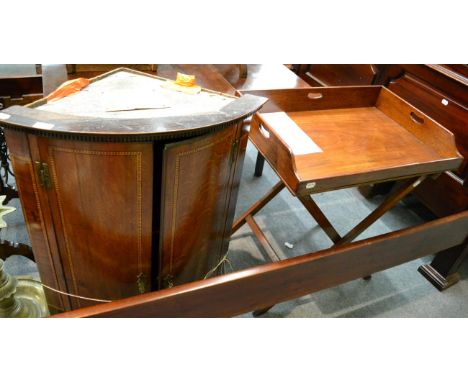 A 19th century mahogany butlers tray on stand, and an 18th century bow fronted oak corner cupboard (2)