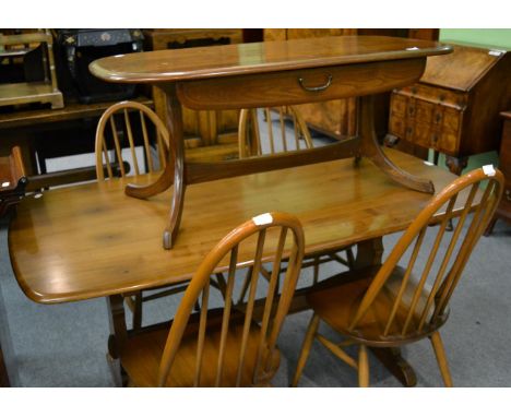 An Ercol dining table, with four dining chairs and a coffee table (6)